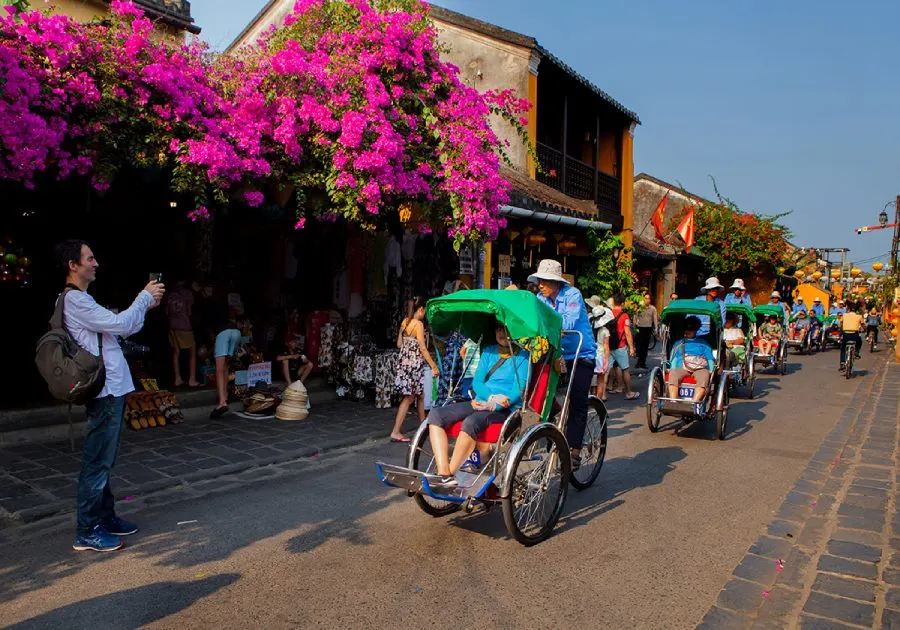 Image highlighting the best things to do in Hoi An in December, including activities like exploring the lantern-lit Old Town, enjoying the serene beaches, participating in local festivals, and dining at riverside restaurants with stunning nighttime views.