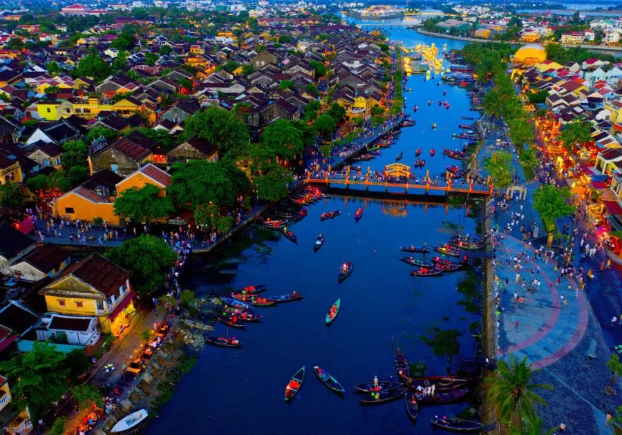 Image highlighting the best things to do in Hoi An in December, including activities like exploring the lantern-lit Old Town, enjoying the serene beaches, participating in local festivals, and dining at riverside restaurants with stunning nighttime views.