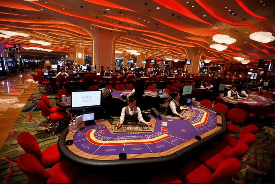 Image of a Sicbo casino in Vietnam, featuring a modern casino building with vibrant lighting, dedicated Sicbo gaming tables, and patrons actively playing the dice game in a lively and upscale casino setting.