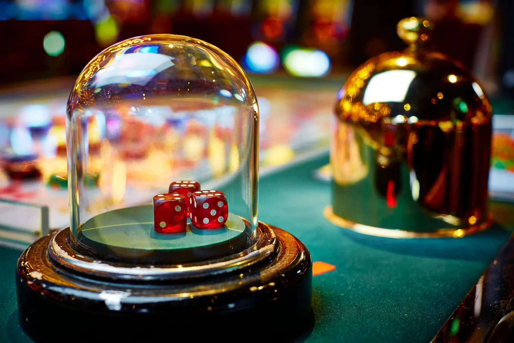 Overview of Sicbo, a traditional dice game played in casinos, featuring players seated around a gaming table with multiple dice, betting chips on the table, and a dealer preparing to roll the dice, highlighting the game's vibrant and engaging atmosphere.