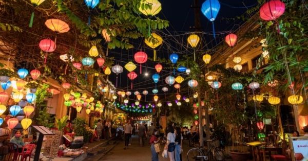 Hoi An nightlife with colorful lanterns lighting up the streets and lively riverside cafes