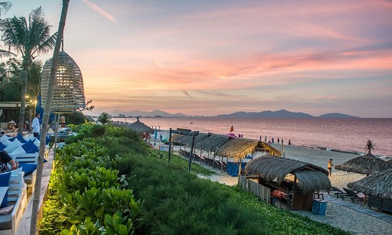 Traveler relaxing on a serene beach in Vietnam with clear blue water and white sand