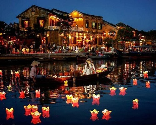 Couple enjoying a peaceful evening stroll through Hoi An's lantern-lit streets