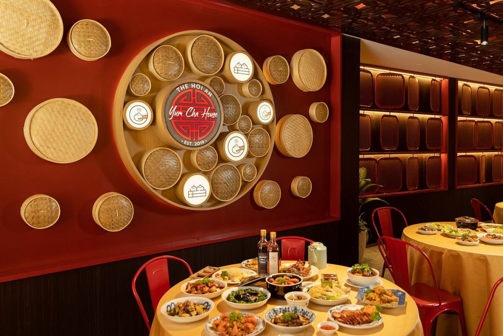 Interior of Yum Cha House Dim Sum Restaurant in Hoi An, featuring a modern dining area with steaming baskets of dim sum