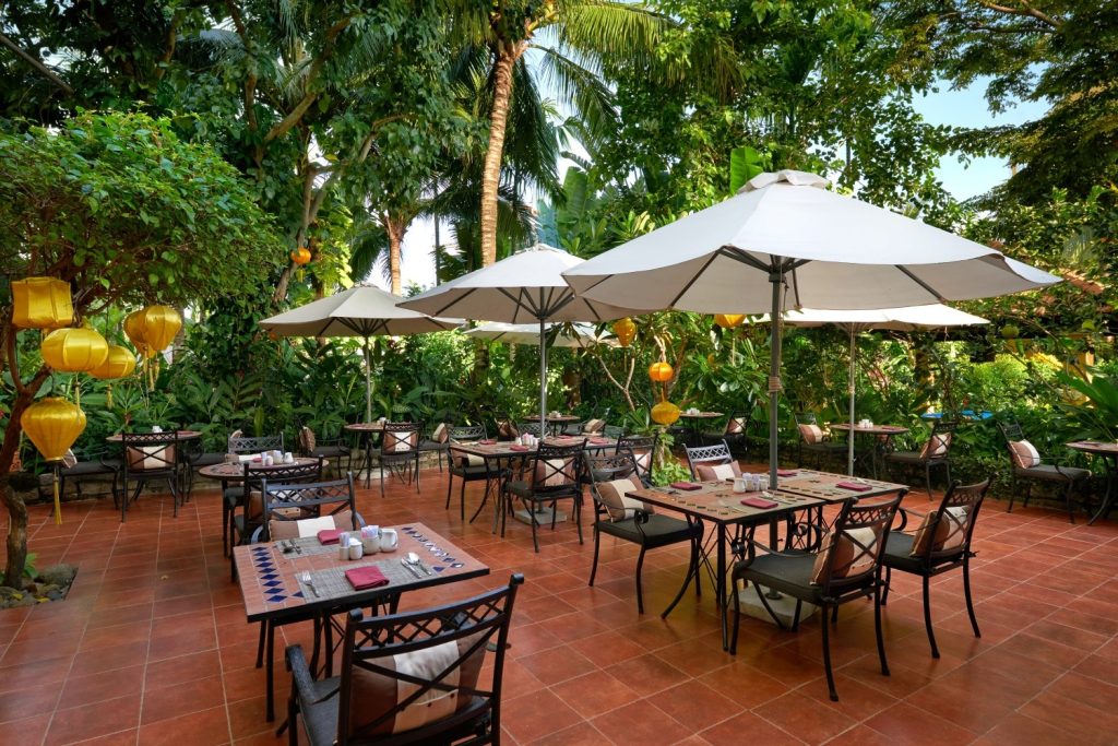 Elegant interior of Red Bean Restaurant in Hoi An, featuring a mix of contemporary and traditional Vietnamese design elements