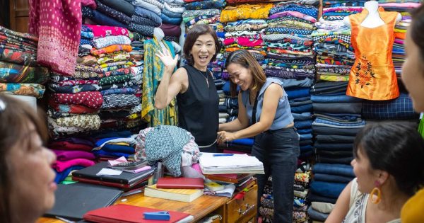 An array of finely tailored garments displayed at one of Hoi An's best tailor shops, showcasing exquisite craftsmanship