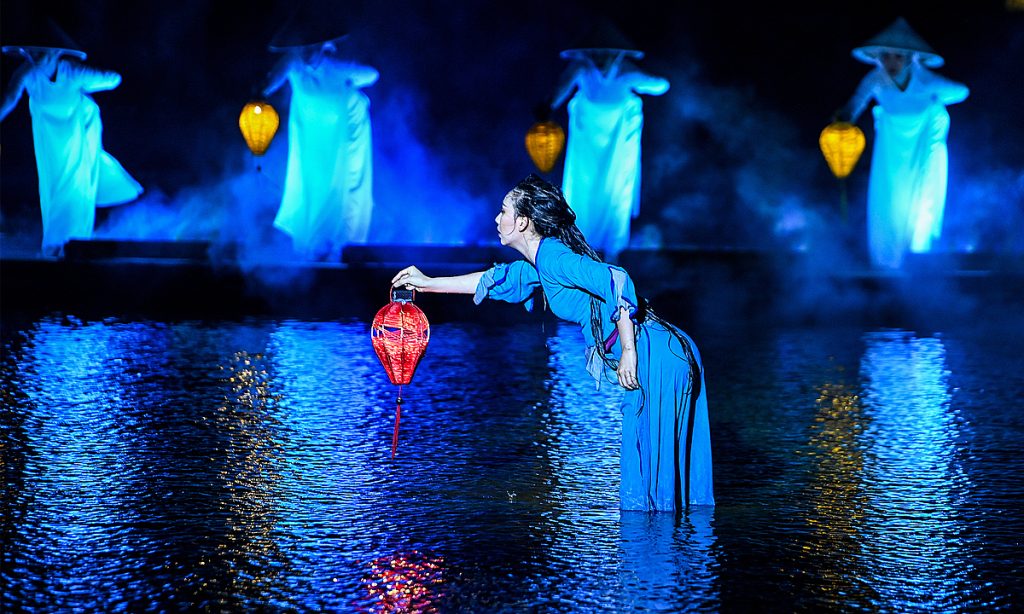 A spectacular scene from the Hoi An Memories Show, featuring vibrant costumes and dynamic performances that bring the history of Hoi An to life