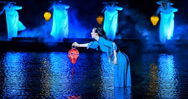 A spectacular scene from the Hoi An Memories Show, featuring vibrant costumes and dynamic performances that bring the history of Hoi An to life