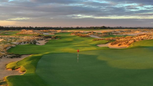 A scenic shot of The Hoiana Shores & Clubs, highlighting its expansive golf course and luxurious clubhouse