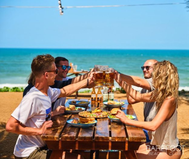 Relaxed setting at Barefoot Beach Club in Hoi An, with rustic decor, casual seating, and direct access to the sandy beach