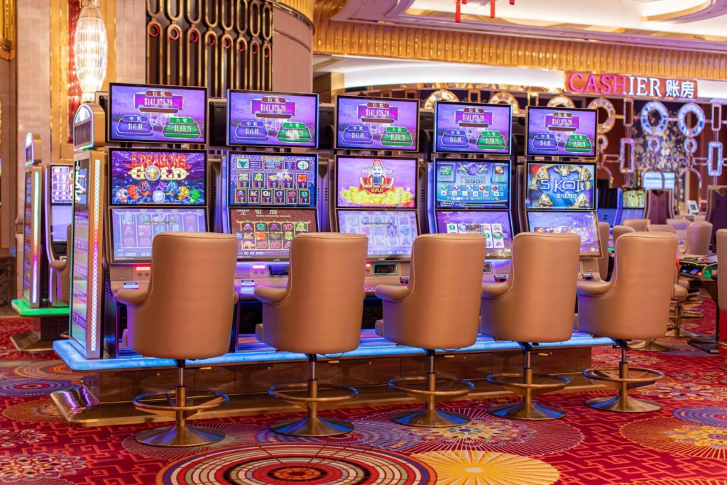 A casino interior with people playing games