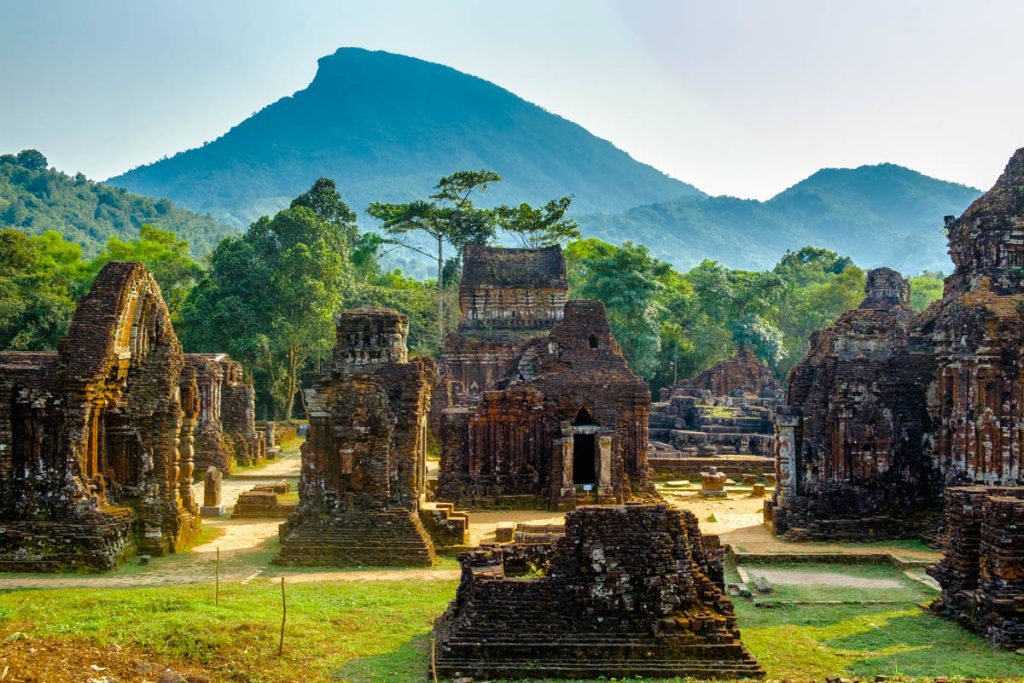 The ancient brick towers and temples of My Son Sanctuary, surrounded by lush green vegetation