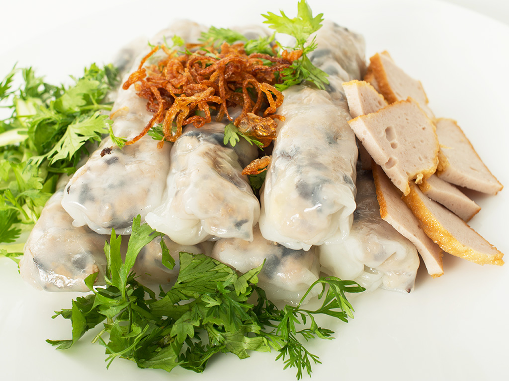 Savor the delicate flavors of Vietnamese steamed rice rolls (Bánh cuốn), filled with savory minced pork and mushrooms.