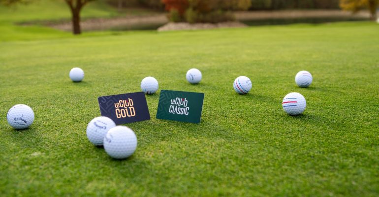 A price board displaying green fees at a golf course in Vietnam.