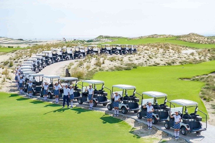 A row of golf carts parked at Hoiana Golf Shores Club, ready for rental.