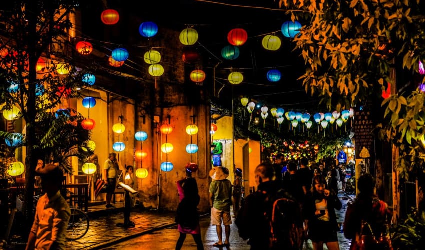 Colorful lanterns floating on the Hoai River during the Hoi An Lantern Festival.