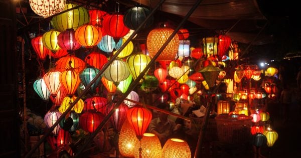 Colorful lanterns floating on the Hoai River during the Hoi An Lantern Festival.