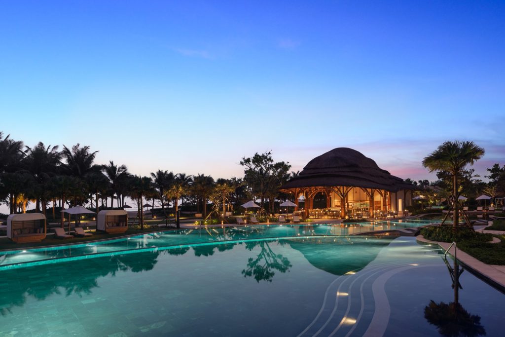 A private pool at a luxurious resort by the serene beachfront.