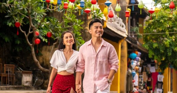 A couple relaxing by the pool at a romantic resort in Vietnam.