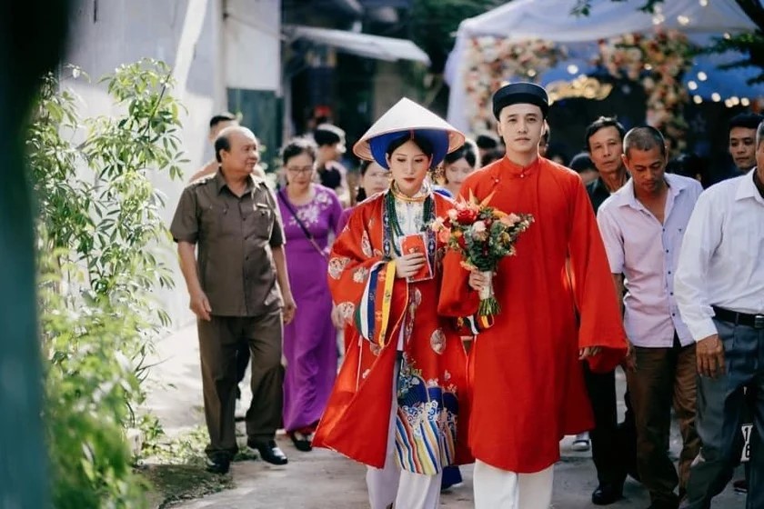  A traditional Vietnamese wedding ceremony with áo dài and symbolic rituals.