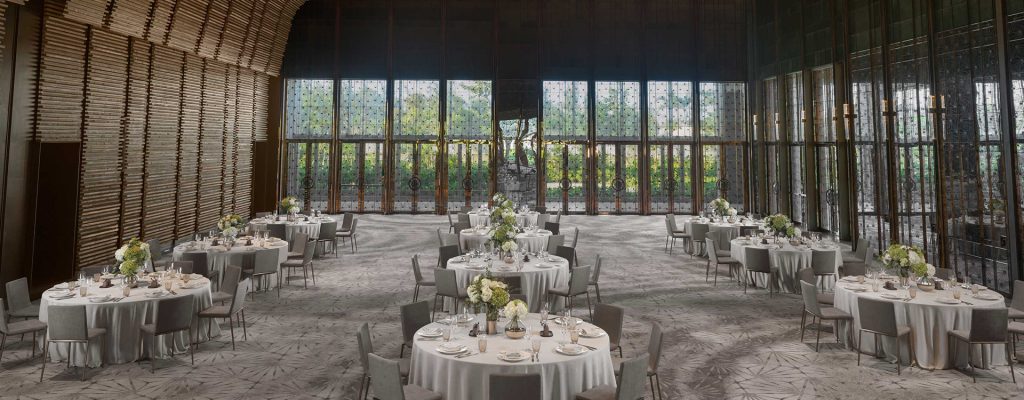 A luxurious ballroom at Hoiana Resort & Golf, decorated for a wedding reception.