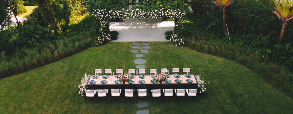 A wedding ceremony setup on a lawn overlooking the beach at Hoiana Resort.