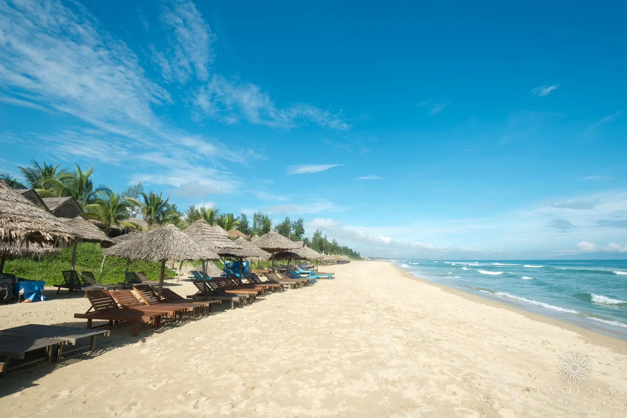 A serene sunset over the best beach in Hoi An, with gentle waves lapping at the shore and vibrant skies, making it a must-visit destination in Hoi An.