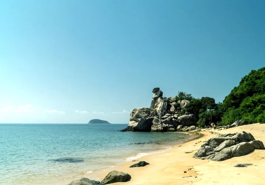 Scenic view of Cham Island, Hoi An, featuring lush greenery, crystal-clear waters, and a tranquil atmosphere perfect for relaxation and exploration.