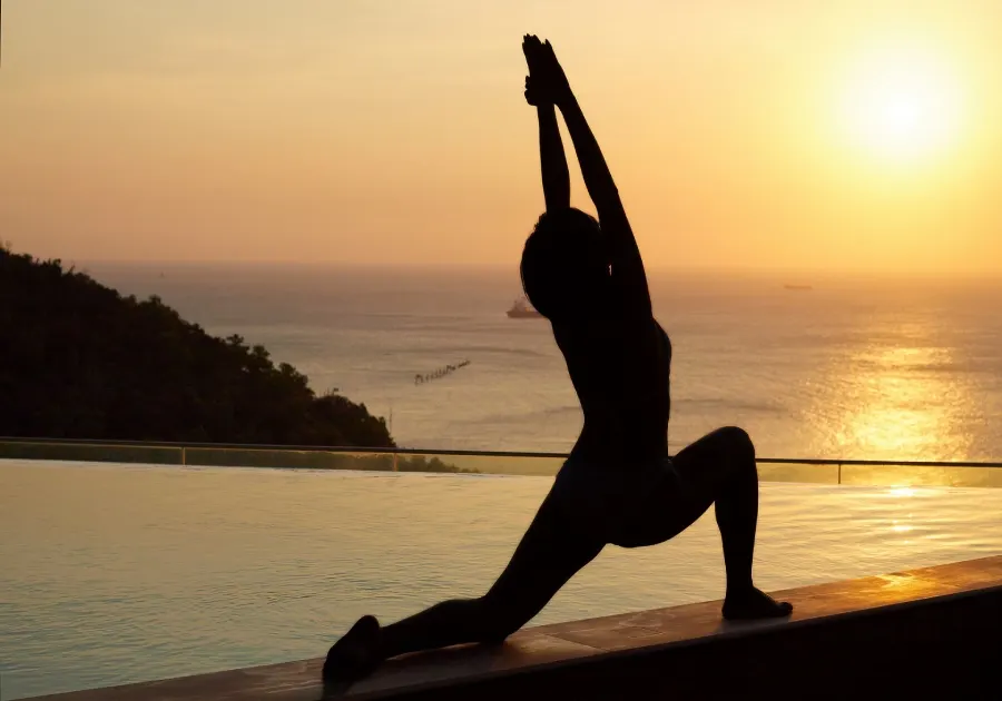 Serene yoga practice in a lush garden setting in Hoi An, surrounded by tropical greenery and a tranquil atmosphere.