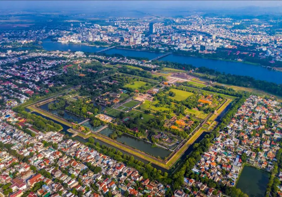 The ancient My Son Sanctuary, a UNESCO World Heritage site in Vietnam, showcasing intricate Hindu temple ruins surrounded by lush greenery.