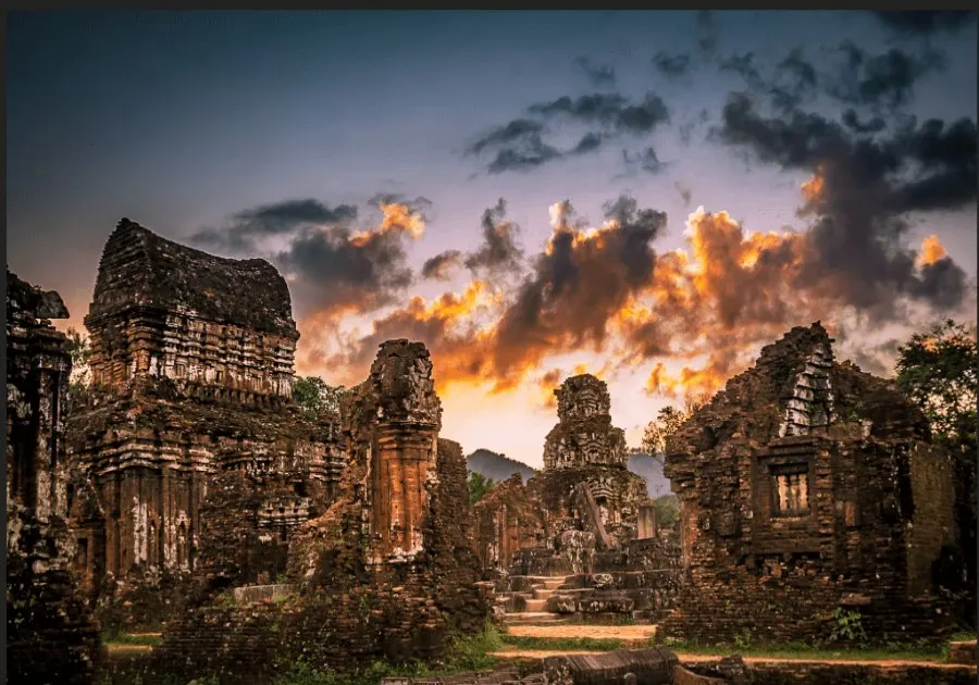 The ancient My Son Sanctuary, a UNESCO World Heritage site in Vietnam, showcasing intricate Hindu temple ruins surrounded by lush greenery.