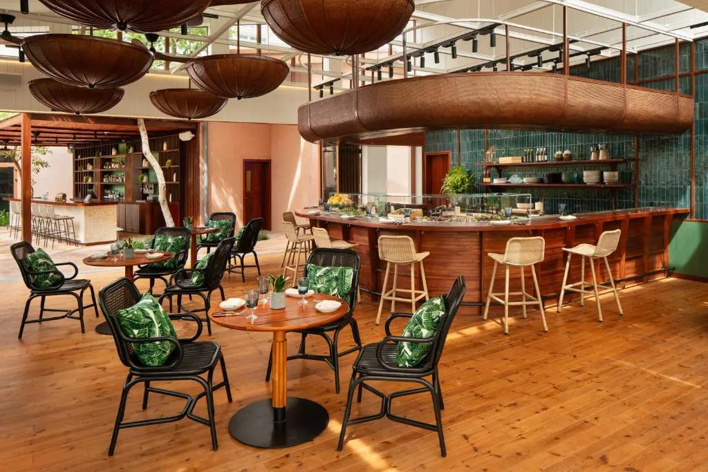 "Stylish cocktail bar in Hoi An with handcrafted drinks, cozy lighting, and a mix of traditional and contemporary decor creating a relaxed evening atmosphere."