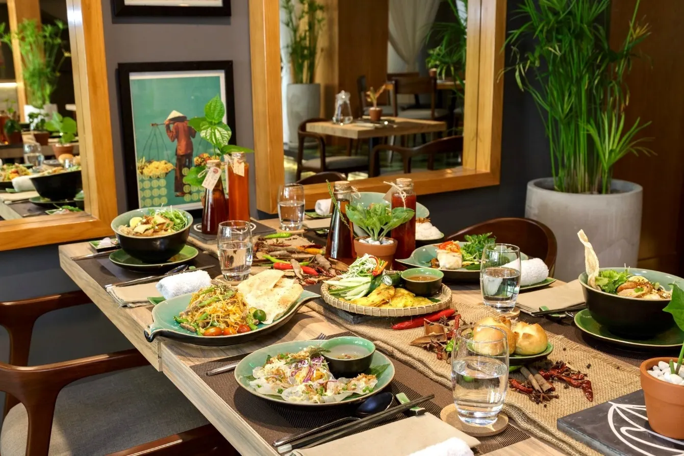 "Authentic Asian restaurant in Hoi An serving a variety of regional dishes in a beautifully decorated space blending modern comfort with traditional charm."