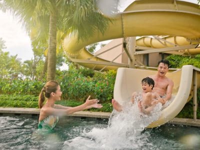 Family enjoying water activities at a resort pool